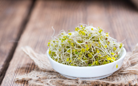 Fresh Broccoli Sprouts (detailed close-up shot) on vintage wooden backgroundの写真素材