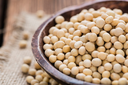 Soy Beans (detailed close-up shot) on rustic wooden backgroundの写真素材