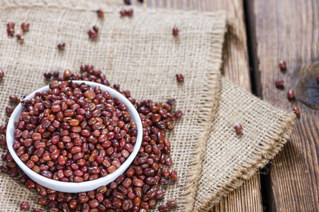 Portion of dried red beans on wooden background (close-up shot)の写真素材
