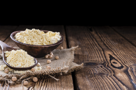 Portion of Chick Pea flour on vintage wooden backgroundの写真素材