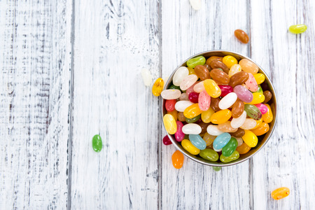 Colorfull Jelly Beans (close-up shot) on bright wooden background