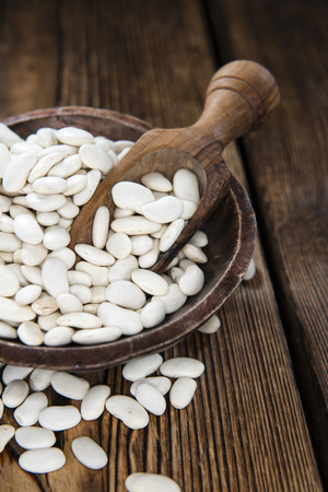 Dried White Beans (close-up shot) on wooden backgroundの写真素材