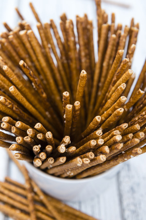 Salt Sticks (close-up shot) on bright wooden backgroundの写真素材