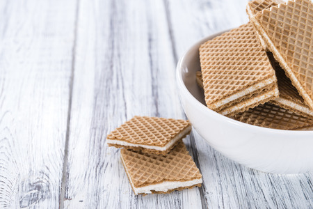 Crispy Waffles with Vanilla Cream (close-up shot) on wooden backgroundの写真素材