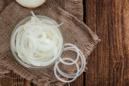 Portion of white Onions (detailed close-up shot) on wooden backgroundの写真素材
