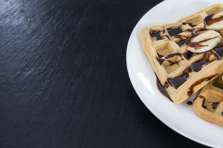 Sweet Breakfast (Waffles with Bananas and creamy Chocolate Sauce)の写真素材