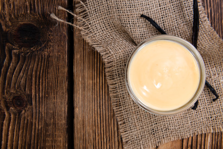 Fesh made Vanilla Sauce (detailed close-up shot) on wooden background