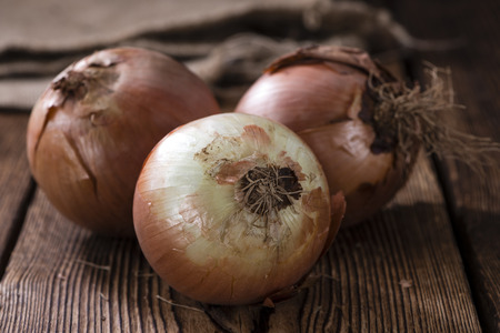 Some white Onions (close-up shot) on vintage wooden backgroundの写真素材