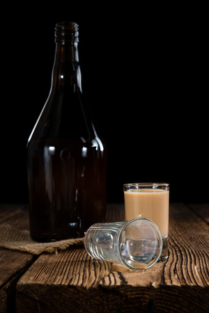 Irish Cream Liqueur (detailed close-up shot) on wooden backgroundの写真素材