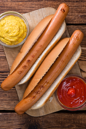 Homemade Hot Dog (close-up shot) on wooden backgroundの写真素材