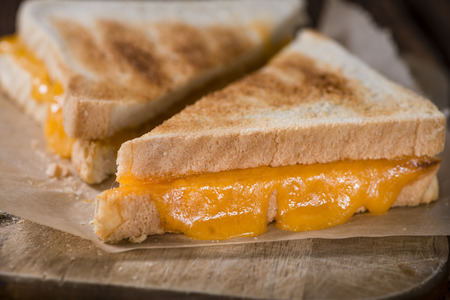 Fresh made Cheese Sandwich (selective focus) on an old wooden table