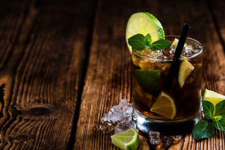 Fresh made Cuba Libre with brown rum and tasty limeの写真素材