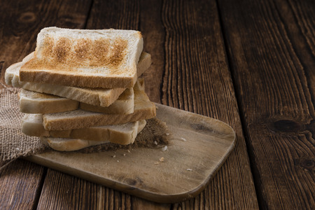 Crispy Toast Bread (selective focus) on wooden background