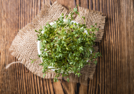 Fresh Cress (close-up shot) on rustic wooden backgroundの写真素材