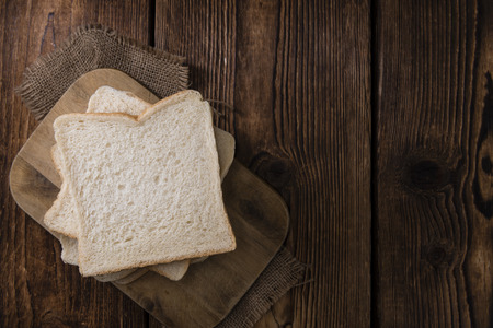 Portion of Toast Bread (selective focus) on wooden background