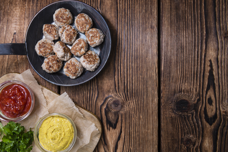Some fresh made Meatballs (selective focus) on wooden backgroundの写真素材