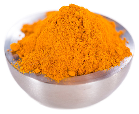 Portion of Turmeric (close-up shot) isolated on white backgroundの写真素材