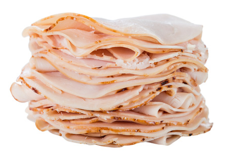 Sliced Chicken Breast Fillet isolated on white (selective  focus)の写真素材