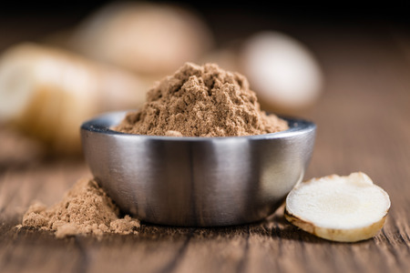 Galaganl Powder (selective focus) on an old wooden table (close-up shot)の写真素材