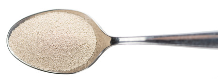 Portion of dried yeast isolated on white backgroundの写真素材