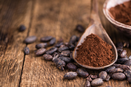 Cocoa powder (selective focus) as detailed close-up shot on wooden backgroundの写真素材