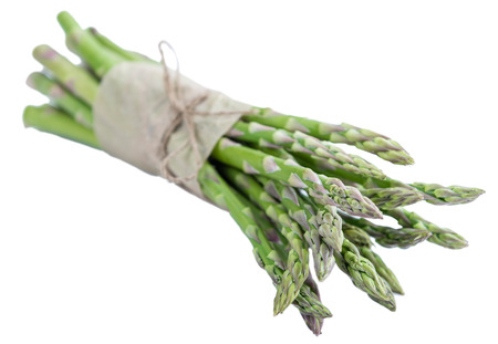 Portion of green Asparagus (close-up shot) isolated on white backgroundの写真素材