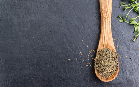 Slate slab with dried Thyme (selective focus) as close-up shotの写真素材