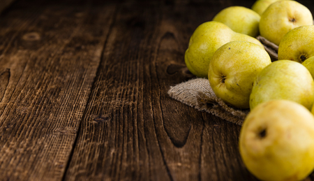 Pears (selective focus) on an old wooden table (close-up shot)の写真素材