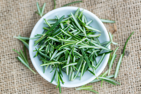 Rosemary (close-up shot; selective focus) on a vintage backgroundの写真素材