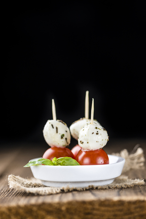 Fresh made Tomato Mozzarella Salad with Basil (selective focus)の写真素材