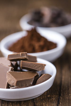 Milk Chocolate (selective focus) on wooden background (close-up shot)の写真素材