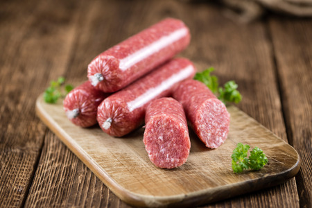 Minced Pork Sausage (German cuisine; selective focus) on wooden backgroundの写真素材