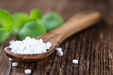 Portion of Stevia sweetener (selective focus; close-up shot) on vintage wooden backgroundの写真素材
