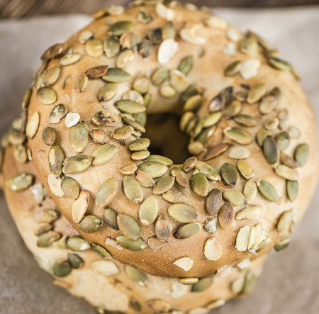 Wholemeal Bagels (selective focus; detailed close-up shot) on vintage backgroundの写真素材