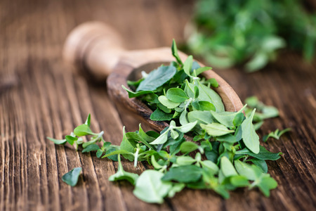 Fresh Menthol Leaves (selective focus) on an old wooden table (close-up shot)の写真素材