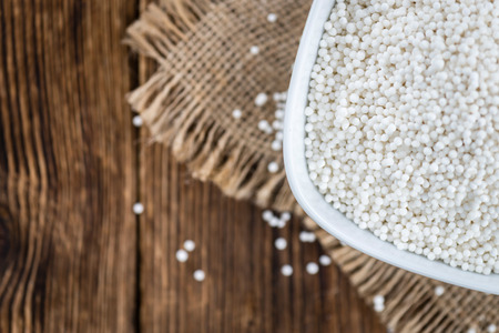 Tapioca on wooden background (selective focus; close-up shot)