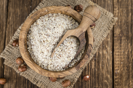 Grounded Hazelnuts (selective focus; close-up shot) on vintage backgroundの写真素材