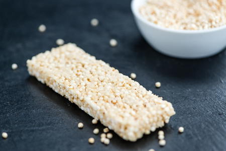 Some Quinoa Bars on a slate slab (close-up shot; selective focus)の写真素材