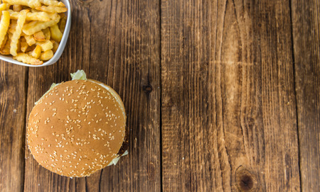 Wooden table with a homemade Falafel Burger (selective focus)の写真素材