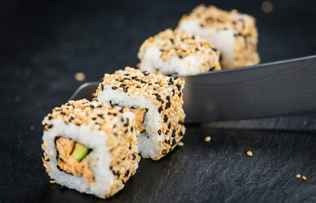 Fresh made Sushi (selective focus) on a vintage looking slate slabの写真素材