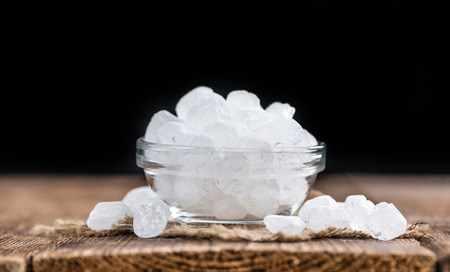 White Rock Candy on wooden background (detailed close-up shot; selective focus)の写真素材