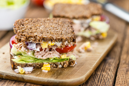 Tuna Sandwich (wholemeal bread; selective focus) on an old wooden tableの写真素材