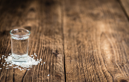Sake (Japanese drink) on an old wooden table