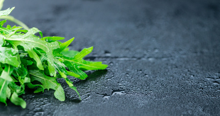 Portion of fresh Arugula (detailed close-up shot; selective focus)の写真素材