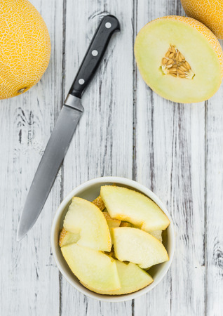 Fresh made Honeydew Melon on a vintage background (close-up shot)の写真素材