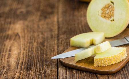 Fresh made Honeydew Melon on a vintage background (close-up shot)の写真素材