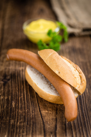 German Sausages (Wiener) as high detailed close-up shot on a vintage wooden table (selective focus)の写真素材