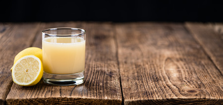 Lemon Juice on a vintage background as detailed close-up shot (selective focus)の写真素材