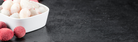 Lychees on a vintage background as detailed close-up shot (selective focus)の写真素材
