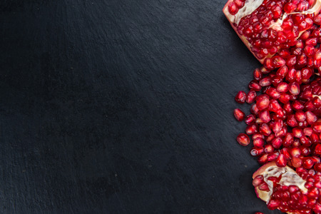 Portion of Pomegranate seeds (close-up shot; selective focus)の写真素材